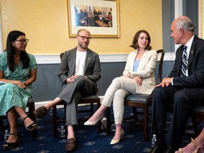 FILE: (L-R) National Domestic Workers Alliance president Ai-Jen Poo, actor Seth Rogen and Lauren Miller Rogen meet with Sen. Bob Casey (D-PA) on Capitol Hill Sept. 14, 2022 in Washington, DC. /