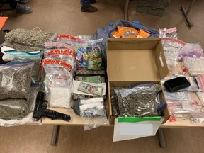 Police image of confiscated drugs and cash. /