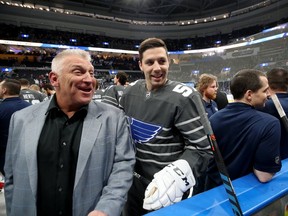 FILE - Former St. Louis Blues player, Brett Hull and David Perron #57 of the St. Louis Blues talk prior to the 2020 Honda NHL All-Star Game at Enterprise Center on January 25, 2020 in St Louis, Missouri.