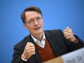 German Health Minister Karl Lauterbach speaks during a news conference in berlin, Wednesday, Oct. 26, 2022. Germany's health minister has unveiled plans to decriminalize the possession of up to 30 grams of cannabis and allow the sale of the substance to adults for recreational purposes.