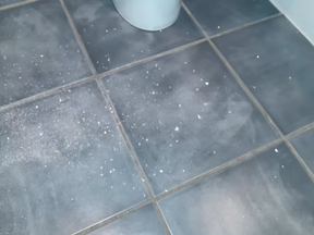 Police find suspected cocaine all over bathroom floor. /