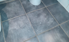 Police find suspected cocaine all over bathroom floor. /