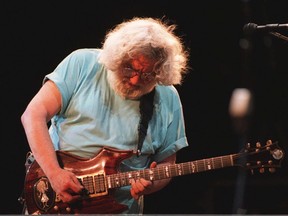 FILE - Jerry Garcia and The Grateful Dead perform at a concert in Washington D.C. in 1995.