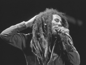 FILE - Jamaican Reggae singer Bob Marley performs in front of an audience of 40,000 during a festival concert of Reggae in Paris, France, July 4, 1980. The biopic "Bob Marley: One Love" has been a box office hit in the United States and several other countries. The film, starring Kingsley Ben-Adir, is focused on the Rastafari legend's story during the making of his 1977 album "Exodus" while leading up to his impactful concert in his native Jamaica.