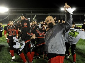 John Barsby head coach Rob Stevenson celebrates 2010 Subway Bowl title