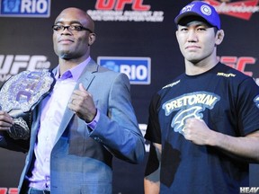 Anderson Silva and Yushin Okami pose for pictures at yesterday's UFC 134 press conference in Rio. (photo courtesy of James Law / Heavy MMA)