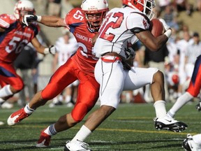 Adam Berger (left) returned a game-turning interception for a touchdown Saturday as the Clan topped host Pacific University. (PNG file photo)