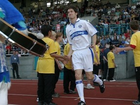 A younger Chris Franks jogs to the pitch at Swangard Stadium. (Josh Devins)