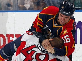 SUNRISE, FL - MARCH 31: Darcy Hordichuk #16 of the Florida Panthers fights with Francis Lessard #49 of the Ottawa Senators at the BankAtlantic Center on March 31, 2011 in Sunrise, Florida. (Photo by Eliot J. Schechter/NHLI via Getty Images)