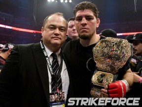 Nick Diaz posing with Strikeforce CEO Scott Coker. (photo courtesy of Esther Lin/Strikeforce)