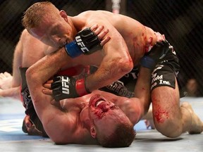 Nick Ring drops an ellbow on James Head during their bout at UFC 131. The Canadian is back in action Saturday night at UFC 135 against Tim Boetsch.