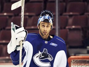 Vancouver B.C. - December 10, 2008 - Roberto Luongo practises with the Canucks Wednedsay at GM Place.  He skated and stretched before taking some shots but left the ice before the end of the session.  Elliott Pap  story. (ian lindsay/Vancouver Sun) [PNG Merlin Archive]