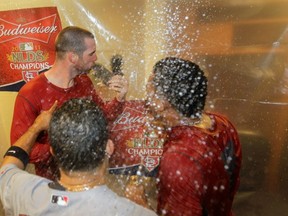 Is that Cardinals ace Chris Carpenter kissing a squirrel? Why wouldn't he?