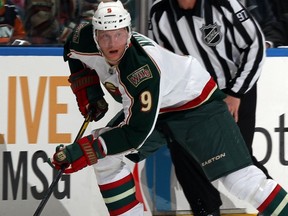 UNIONDALE, N.Y. — Mikko Koivu of the Minnesota Wild goes to the offensive against the Islanders on Oct. 10. The captain suffered a scary skate cut under his chin Friday in Edmonton. (Getty Images)