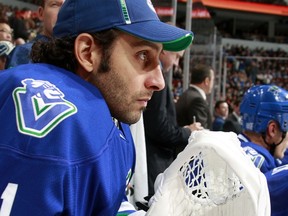 VANCOUVER — Roberto Luongo looks to have a lot on his mind while watching and Oct. 22 meeting between the Canucks and Minnesota Wild at Rogers Arena. (Photo by Jeff Vinnick/NHL via Getty Images)