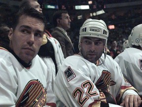 Kirk McLean (left) on the bench with Jeff Brown in 1995. (Rick Loughran/PNG)