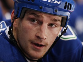 VANCOUVER: Rick Rypien of the Canucks looks on from the bench during an April 10, 2010 game against the Calgary Flames at Rogers Arena. Jeff Vinnick photo