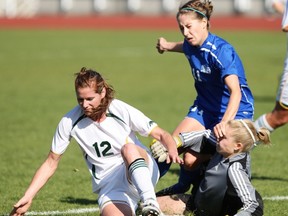 Victoria's Jacquline Harrison causes havoc for Regina keeper Michelle Anderson and Dana Renneberg during CIS soccer game played Sunday at Centennial Stadium. (Adrian Lam, Victoria Times Colonist)