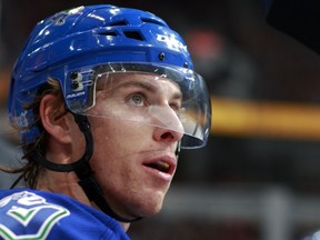 VANCOUVER — David Booth watches play Oct. 29 against Washington. The new Canucks winger believes a current team bonding session in Southern California is crucial to team success. (Photo by Jeff Vinnick/NHL via Getty Images).