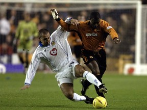 Paul Ritchie (left), at the time on loan to Portsmouth, tackles Nathan Blake of Wolverhampton Wanderers in 2002. (Mark Thompson/Getty Images)