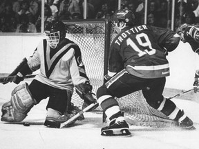 Canucks goalie Richard Brodeur tries to shut the door on Bryan Trottier in the 1982 Stanley Cup final. (Wayne Leidenfrost/Province files)