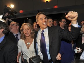 Vancouver Mayor Gregor Robertson celebrates his re-election with his wife Amy and other Vision supporters on election night. JASON PAYNE/ PNG FILES
