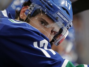 VANCOUVER — Ryan Kesler looks on from the Canucks bench during Oct. 20 game against Ottawa. His legs and lips are in good working order in anticipation of tonight's tough matchup in San Jose against the Sharks. (Jeff Vinnick/Getty Images/via National Hockey League).