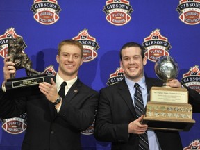 Canada's quarterbacks share a moment Thursday night at the Vancouver Convention Centre as UBC's Billy Greene (right) hoists the Hec Crighton Award in unison with CFL Most Outstanding Player Award winner Travis Lulay of the B.C. Lions. (Ian Lindsay, PNG)