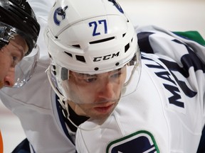 PHILADELPHIA — Manny Malhotra gets ready to perform his specialty against the Flyers on Oct. 12. The Canucks centre has been slow to find his overall form but has been effective in the faceoff circle. (Getty Images/National Hockey League).