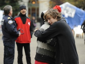VANCOUVER, BC: OCTOBER 3, 2011 -   Two young men embrace during Occupy Vancouver protests at the Vancouver Art Gallery  in Vancouver, B.C., November 3, 2011.  First Responders were called to help after an occupier suffered a cardiac arrest.

(Arlen Redekop photo/ PNG)

(For story by [John Colebourn])