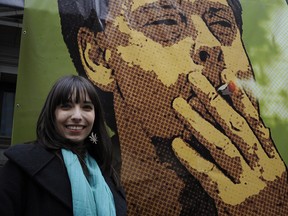Marijuana activist Jody Emery stand in front of a poster of her husband, jailed Vancouver marijuana community leaders Marc Emery, during Vancouver's annual marijuana freedom rally in April that drew thousands to the art gallery. MARK VAN MANEN/PNG FILES