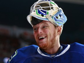 VANCOUVER — Cory Schneider has reason to smile. The backup goalie is making his third-straight start Wednesday as the Canucks face the Avalanche in Colorado.  (Photo by Jeff Vinnick/NHLI via Getty Images).