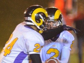 Mt. Douglas quarterback Jordan Deverill hands off to running back Terrell Davis on Saturday during the Rams' win over St. Thomas More. (Ric Ernst, PNG photo)