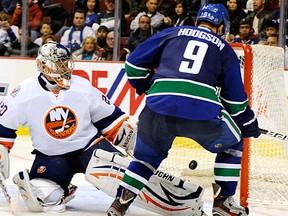 Center Cody Hodgson(9) of the Vancouver Canucks taps in a goal past Evgeni Nabokov(20) of the New York Islanders in the third period of their game in NHL hockey at Rogers Arena in Vancouver, November 13, 2011.  Vancouver won the game 4-1.    (Stuart Davis/PNG)
