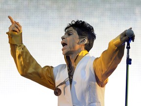 US singer and musician Prince (born Prince Rogers Nelson) performs on stage at the Stade de France in Saint-Denis, outside Paris, on June 30, 2011. AFP PHOTO BERTRAND GUAY