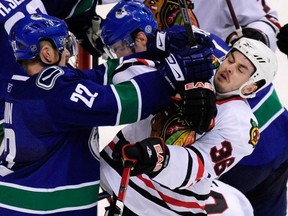 VANCOUVER, BC.: May 9, 2009 --  Vancouver Canucks' left winger Daniel Sedin (22) pushes  Chicago Blackhawks'centrew Dave Bolland (36)  during first period round two game five NHL Stanley Cup playoff action at GM Place Stadium, Vancouver,  BC. May 9, 2009.

(NICK PROCAYLO/ THE PROVINCE)

(See SPORT story)