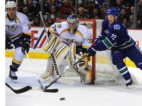 Daniel Sedin swoops around the net against Nasvhille on Thursday night. (Steve Bosch/PNG)