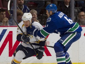 Andrew Alberts, seen here chasing Jordin Tootoo in the Canucks zone in a game at Rogers Arena on Dec. 1, made the mistake of doing the same thing against Mike Cammalleri last Wednesday when he should have been covering the point.