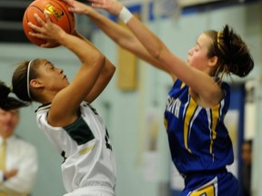 York House star Alisha Roberts (left) is defended by Handsworth guard Elisa Homer Friday during Telus semifinals at Churchill. (Ric Ernst, PNG)