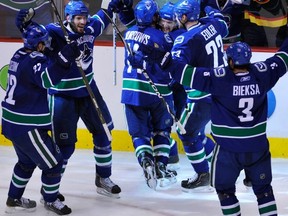 Canucks celebrate Kevin Bieksa's weird double-overtime blooper that won last spring's West final.