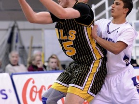 Kelowna Owls' forward Braxston Bunce backs in Vancouver College's Justin Sanvido during Saturday's Telus Basketball Classic at UBC's War Memorial Gym. (Les Bazso, PNG)