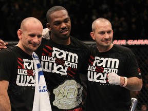 TORONTO, ON - DECEMBER 10:  UFC Light Heavyweight Champion Jon "Bones" Jones poses for a photo with his trainers Greg Jackson (L) and Mike Winklejohn (R) after defeating Lyoto Machida during the UFC 140 event at Air Canada Centre on December 10, 2011 in Toronto, Ontario, Canada.  (Photo by Nick Laham/Zuffa LLC/Zuffa LLC via Getty Images)
