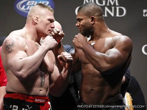 Brock Lesnar and Alistair Overeem square off at the UFC 141 weigh-ins yesterday in Las Vegas. The former heavyweight champions collide tonight on pay-per-view. (photo courtesy of Esther Lin/MMAFighting.com)