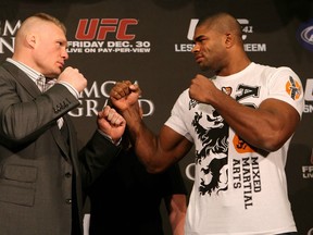 LAS VEGAS, NV - DECEMBER 28:  (L-R) Heavyweight opponents Brock Lesnar adn Alistair Overeem face off during the UFC 141 pre-fight press conference at the MGM Grand Hotel and Casino on December 28, 2011 in Las Vegas, Nevada.  (Photo by Josh Hedges/Zuffa LLC/Zuffa LLC via Getty Images)