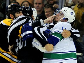 BOSTON, MA - JUNE 06:  Milan Lucic #17 of the Boston Bruins taunts Alex Burrows #14 of the Vancouver Canucks during Game Three of the 2011 NHL Stanley Cup Final at TD Garden on June 6, 2011 in Boston, Massachusetts.  (Photo by Harry How/Getty Images)