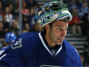 VANCOUVER — Canucks goaltender Roberto Luongo gets his game face on Oct. 29 against Washington. Tonight, he makes his first start in three weeks against Calgary. (Photo by Jeff Vinnick/NHL via Getty Images).