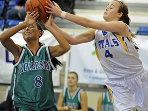 Handsworth's Elisa Homer (right) fights for possession with Riverside's Michelle Spacek during Telus Classic final at UBC's War Gym. (Les Bazso, PNG)