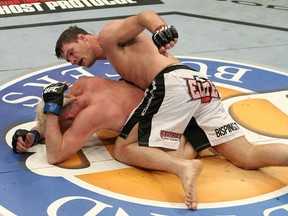 Michael Bisping pounds out a victory over Jason "Mayhem" Miller at the Ultimate Fighter Finale Saturday night in Las Vegas. (photo courtesy of Josh Hedges/Zuffa LLC/Zuffa via Getty Images)