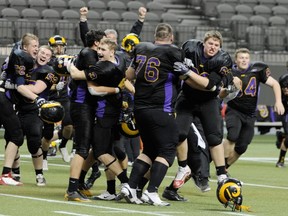 Mt. Douglas Rams' players celebrate the school's first Triple A football title on Saturday (Ric Ernst, PNG)