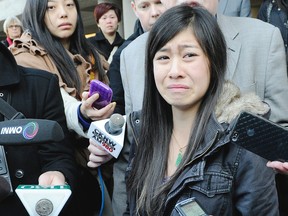 Tracey Phan, daughter of injured Langley mushroom farm worker Michael Phan, speaks to reporters outside Surrey Provincial Court in Surrey after farm was fined for 2008 accident that killed three workers and left two with permanent brain damage. NICK PROCAYLO/PNG FILES